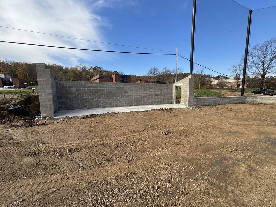 Block dugout and batting cage wall