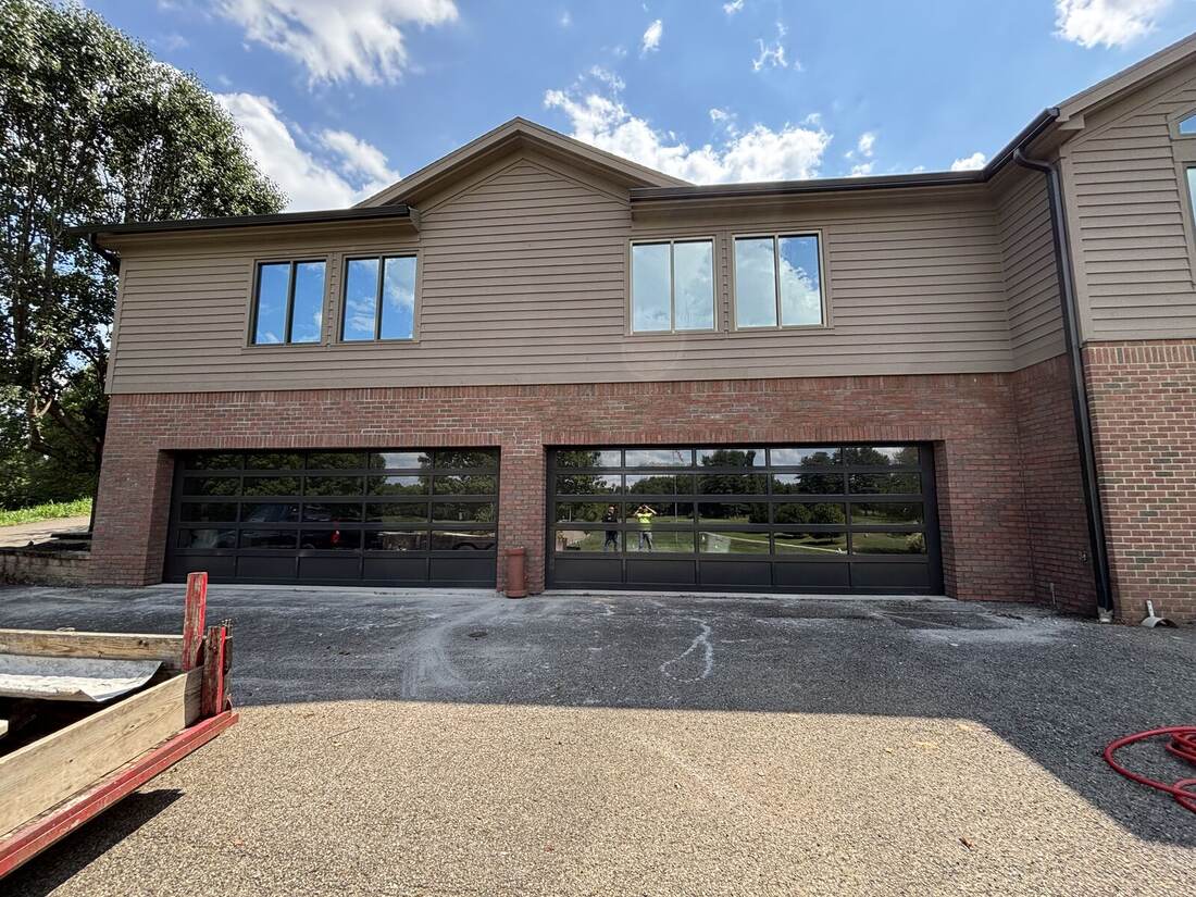 Brick and glass-panel garage doors