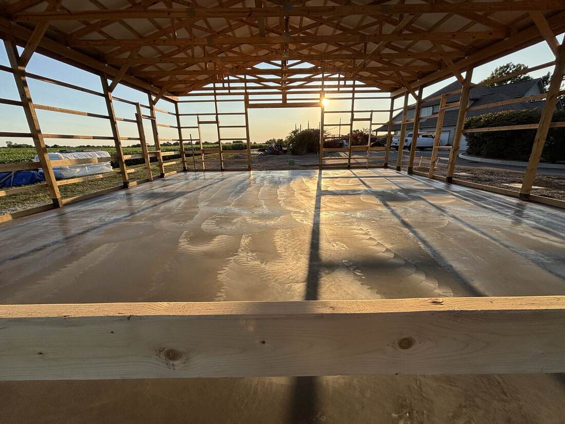 Pole barn concrete floor at sunset