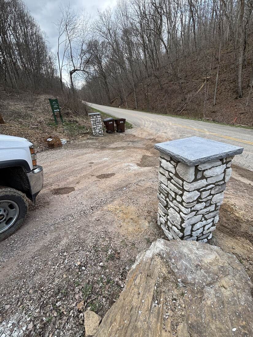 Stone gate pillar along driveway